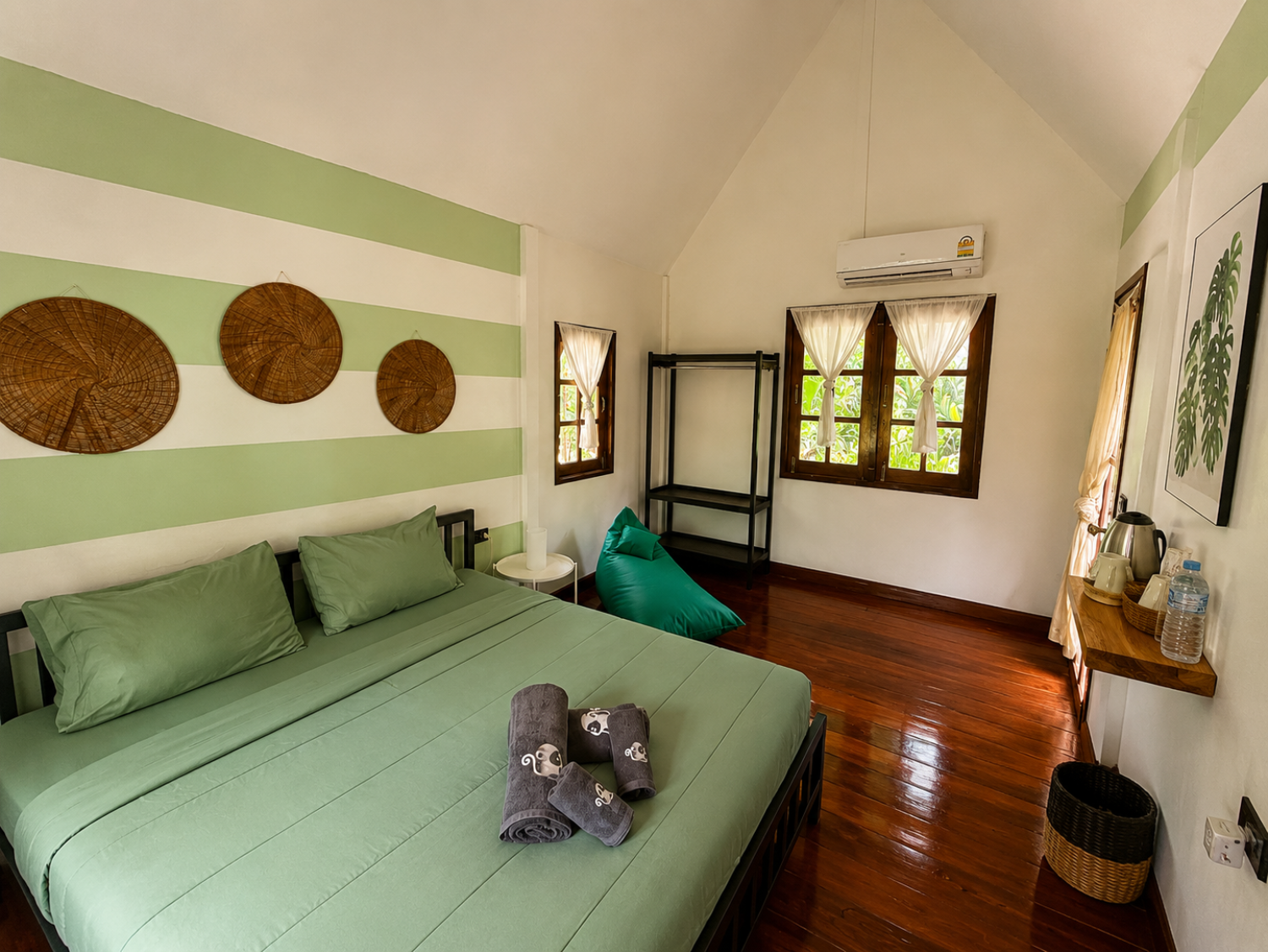 Second interior view of a Jungle Bungalow showing its natural materials and open layout